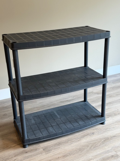 Plastic shelf unit. Has 5 shelves, not just 3 as photographed, View more