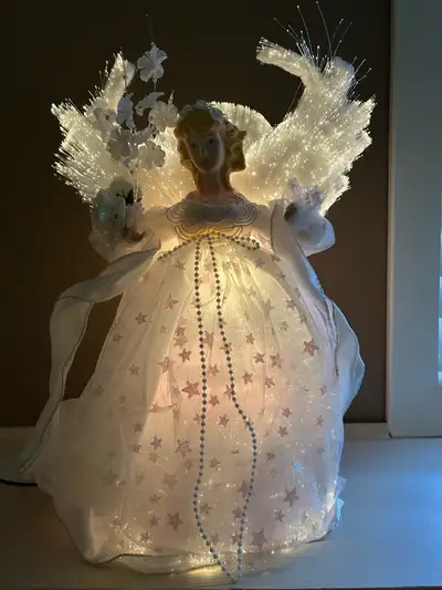 This fibre optic angel tree topper is in great condition. It’s multicoloured and you can use it as a...
