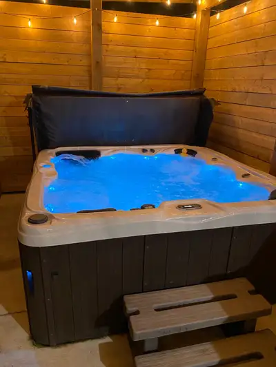 Hot tub is almost 1.5 years old everything works hot tub has zero issues can be seen running and wor...