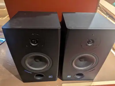 A pair of Yorkville YSM1P powered studio monitor speakers, known for their accurate sound reproducti...