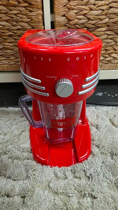 Up for sale is a brand new never used Nostalgia Coca-Cola Frozen Drink Maker and Margarita Machine f...