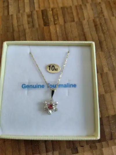 10 kt yellow gold pendant and chain with  pink tourmaline., View more
