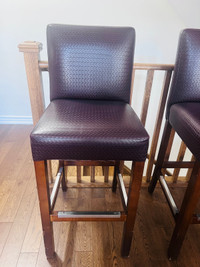 2 brown leather bar stools 