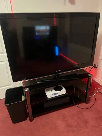 Tv and the stand for sale. Give me a fair offer and take it.