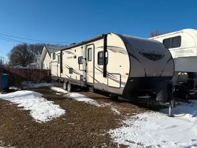 2016 Wildwood by Forest River travel trailer. 2 slides, 2 entrances, sleeps 8. Outside kitchen, 3 bu...