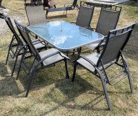 Glass patio table and 6 chairs