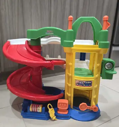 This Fisher-Price Little People playset garage, perfect for toddlers and young children who love car...