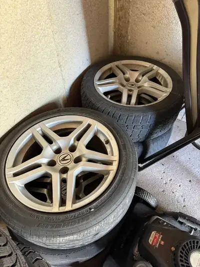 I'm selling a set of four Acura rims with used Michelin tires on them along with a set of 4 good con...