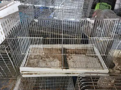 Tray is solid, doors are spring loaded and close well. A good little cage but I don't own birds suit...