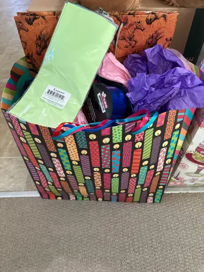 Variety of gift bags/tissue paper/ribbon, View more