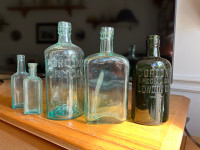 Antique aqua & green bottle group of five