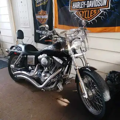 Lowrider with quick detach windshield. Has new Michelin tires, Forward pegs,lots of chrome, lots of...