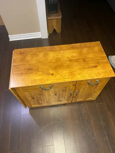 I AM OFFERING A BARELY USED SEWING MACHINE TABLE WITH STORAGE COMPARTMENTS AND TABLE EXTENTION, AS P...