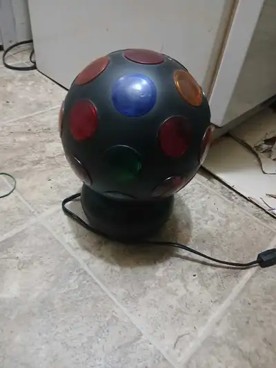 Add some groovy vibes to your space with this used disco ball light, perfect for parties or just add...