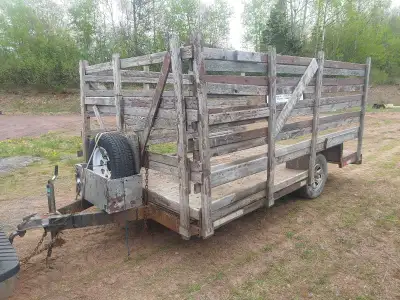 This sturdy single-axle utility trailer with high wooden side walls is ready to haul your heavy load...