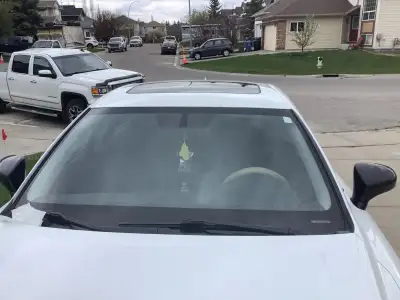 Selling my beautiful car in great condition comes with pearl white exterior and black leather interi...