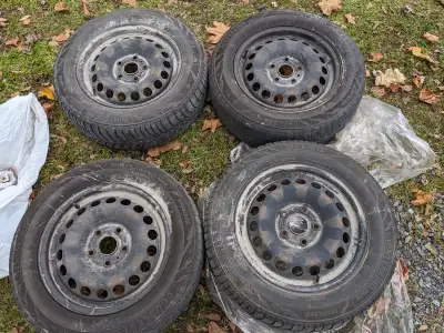 4 rims with winter tires. The tires are not worth keeping. 5 - 112mm? bolt pattern, 57mm center. $10...