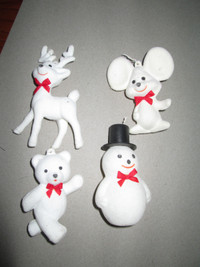 4 white xmas ornaments.