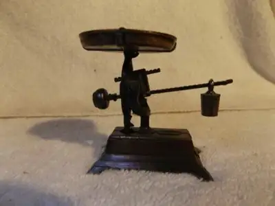 Antique finish mini pencil sharpener that really works. The scale actually pivots up & down with adj...