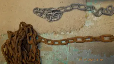 Old Heavy metal Rusted Towing Chain 12 feet approx. Plus a smaller chain; approx. 2 feet $25.00 for...