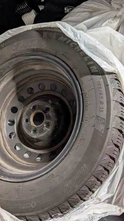 These are four Michelin winter tires, size 195/65R15 mounted on steel rims. These winter tires have...