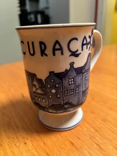 Add a touch of charm to your morning coffee with this delightful Delft hand-painted mug, showcasing...