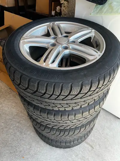 Set of 4 winter tires mounted on genuine Audi OEM alloy rims. Ready to swap on for next season. • Ti...