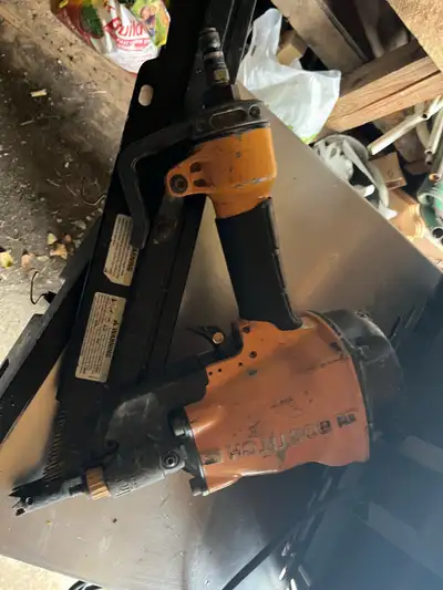 I'm selling a used Bostitch LP233 pneumatic nail gun, designed for precision and efficiency in vario...