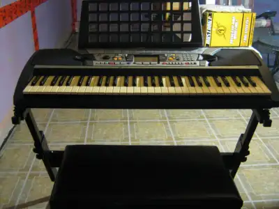 YAMAHA PSR 280 KEYBOARD WORKS GREAT COMES WITH PADDED BENCH NO TEARS AND A STAND AND CORD $75 FOR AL...