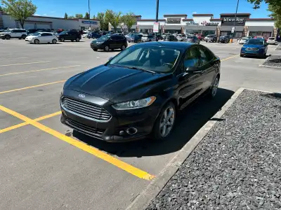 2013 Ford Fusion SE -Sync 2 with navigation - 2 sets of near new tires (2 sets of rims) - mostly hig...