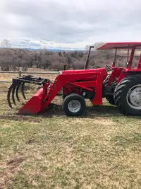 Massey 283 tractor with grapple