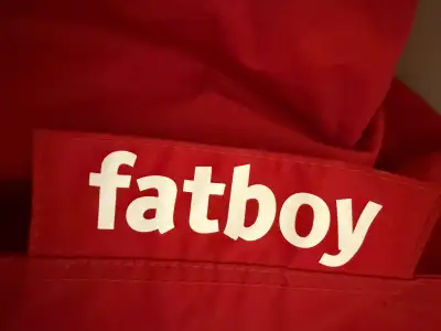 Fatboy beanbag chair in REd -tiny balls adjust for your shape -very relaxing -nylon exterior, easy t...