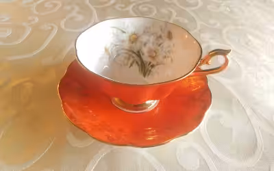 FINE BONE CHINA WIDE CUP AND SAUCER - ROYAL ALBERT, ENGLAND. MONTROSE SHAPE - BOLD ORANGE AND WHITE...