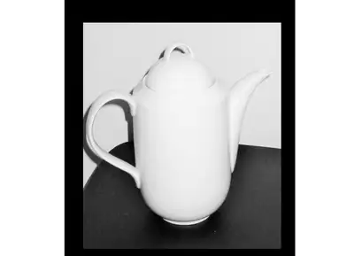 Contemporary designed white Coffee or Tea Pot that will match up with many dishware settings. Large...