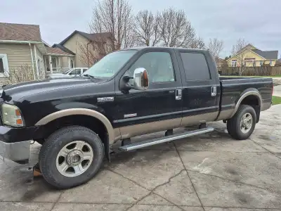 Ford F-350 Lariat, 6.0L diesel, equipped with a 5th wheel hitch, ready for towing your trailer. Has...