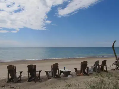 Lakeshore cottage on wide sandy beach, View more