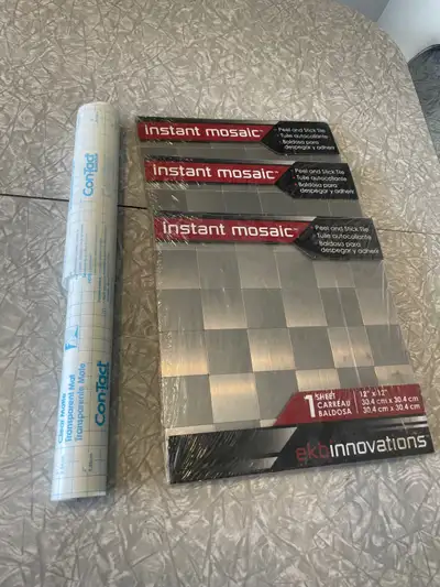 The 3 10 X 10 inch tiles are brand new and still in the packaging. The transparent mat roll has lots...
