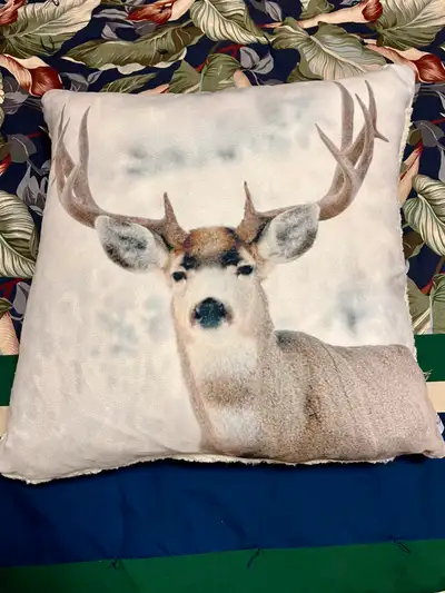 Winter Deer Pillow which is 16” wide, 16” long, and 6” deep. The feather pillow insert. The pillow c...