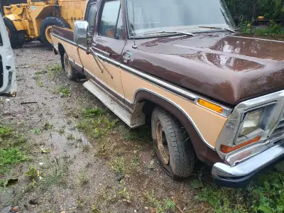 This 1977 Ford half ton pickup truck is a classic workhorse, featuring a robust design and vintage c...