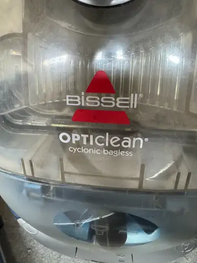Keep your carpets clean with this Bissell Opticlean bagless cyclonic vacuum. It's in good working or...