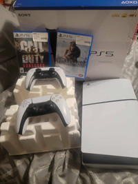 Ps5 in box, with controller + extra controller and two games.