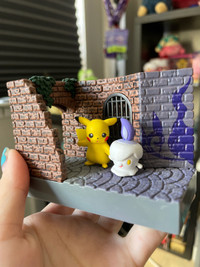 Pokémon Pikachu and Litwick figurine