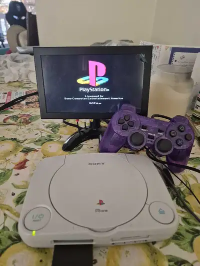 Step back into the pixelated past with this used Sony PSone! This little system comes complete with...