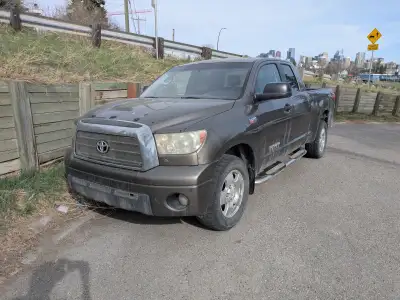 Well used and loved Toyota Tundra. Great work truck that gets the job done. Has some dents and rust....