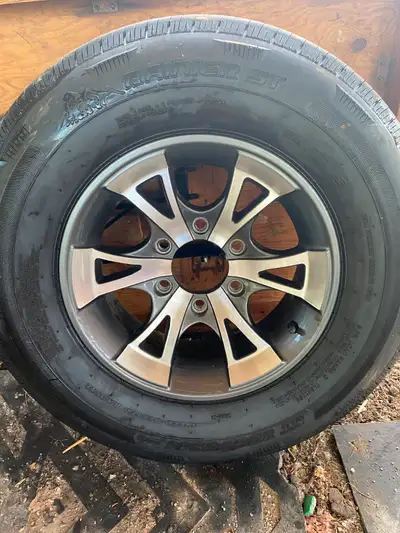 6 bolt, nice rim Rainier ST load range D. Still has lots of tread. 225/75/15