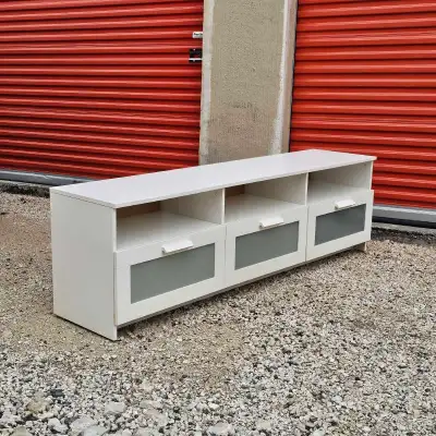 Large TV stand with 3 storage drawers to provide a lot of storage space. Delivery Available for a fe...