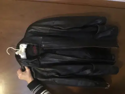 Black. Tag says small but fits more like a medium. Please call. No emails. 403 527-5385