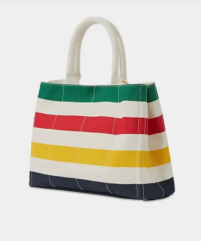 BRAND NEW WITH TAGS NEVER USED 12.6"W x 10"H x 5"D This roomy tote styled with the ICONIC HBC multis...