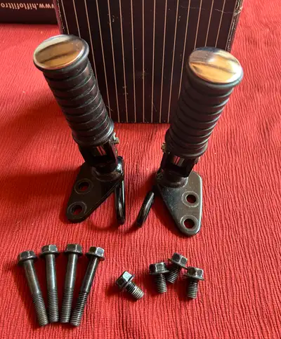 I am selling a set of new Yamaha V-Star motorcycle parts, specifically the foot pegs, complete with...