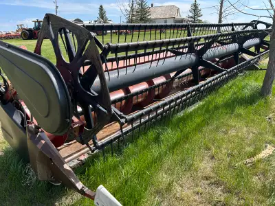 Posting for my father in law. Header is located in Ponteix Sk. For sale is a 22 foot 1020 case flex...